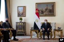 Secretary of State Antony Blinken, left, is seated during a meeting with Egyptian President Abdel Fattah el-Sissi at the Heliopolis Presidential Palace, May 26, 2021, in Cairo, Egypt.