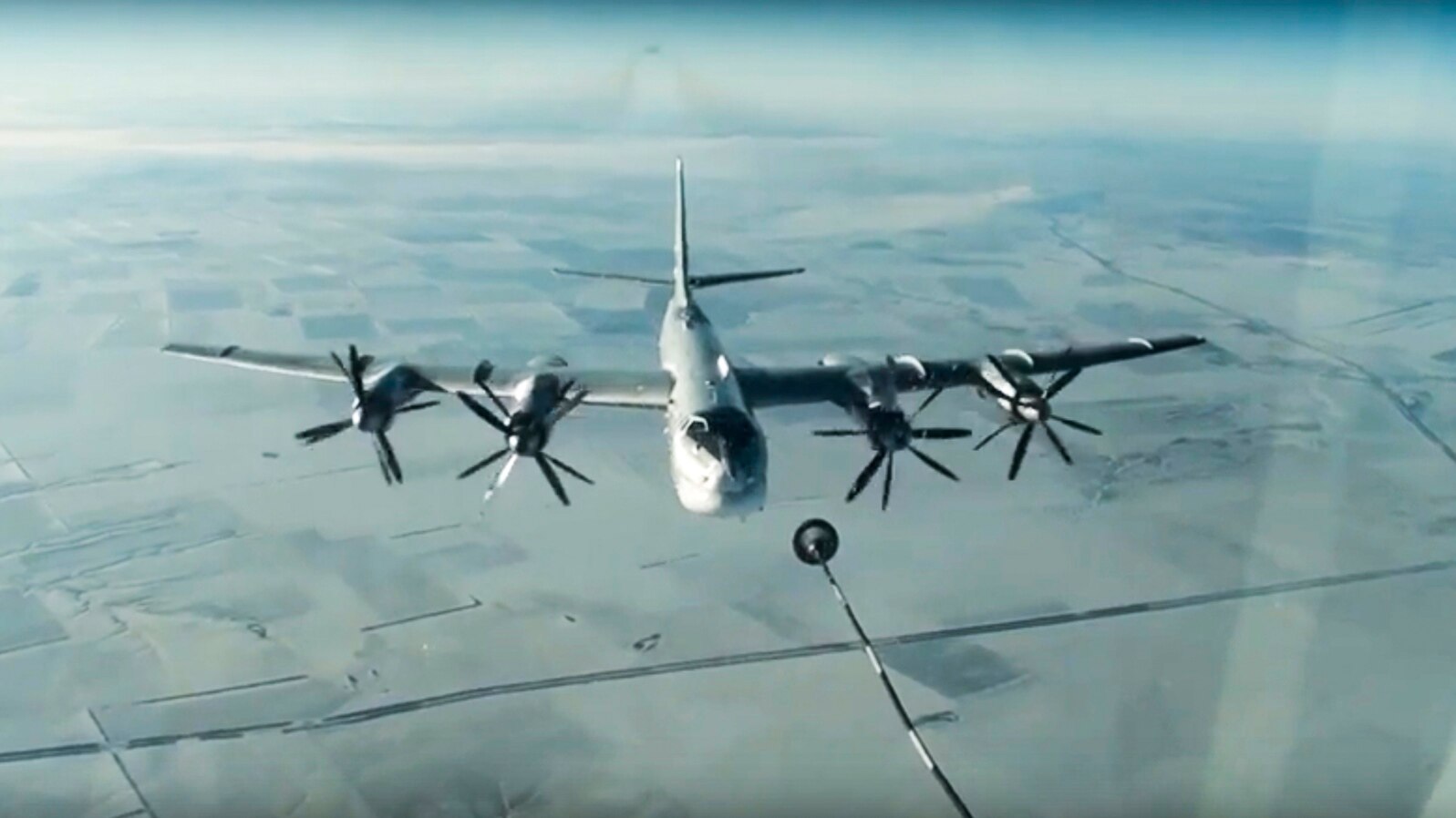 FILE - A Tu-95 strategic Russian bomber is in flight over Syria, from footage taken from the Russian Defense Ministry official website, Nov. 17, 2016. 