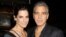This image released by Starpix shows Sandra Bullock, left, and George Clooney at luncheon honoring the film "Gravity," Oct. 2, 2013.