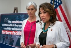 Rep. Veronica Escobar, D-Texas, joined at left by Rep. Katherine Clark, D-Mass., vice chair of the Democratic Caucus, speaks with reporters following a meeting of fellow Democrats focusing on a path to emergency humanitarian aid to help migrant detained on the southwestern border.
