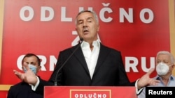 Montenegrin President and leader of ruling Democratic Party of Socialists, Milo Djukanovic, speaks to the media after the general election in Podgorica, Montenegro, Aug. 30, 2020.