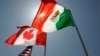 FILE - National flags representing the United States, Canada and Mexico fly in the breeze in New Orleans, ahead of a trade meeting, April 21, 2008.