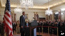U.S. President Barack Obama receives a standing ovation after a speech about the United States' policy on the Middle East and North Africa at the State Department in Washington, May 19, 2011.