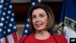 Speaker of the House Nancy Pelosi, D-Calif., talks to reporters on the morning after the first public hearing in the impeachment probe of President Donald Trump.