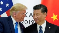 FILE PHOTO: Trump meets Xi at the G20 leaders summit in Osaka, Japan