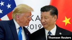 FILE PHOTO: Trump meets Xi at the G20 leaders’ summit at the International Exhibition Center in Osaka, Japan, 29 June 2019.