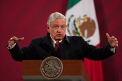 FILE - Mexican President Andres Manuel Lopez Obrador gives his daily news conference at the presidential palace in Mexico City, Dec. 18, 2020.