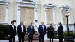 President Donald Trump stands outside St. John's Church, June 1, 2020, in Washington. Standing with Trump are Mark Esper, from left, William Barr, Robert O'Brien, Kayleigh McEnany and Mark Meadows.