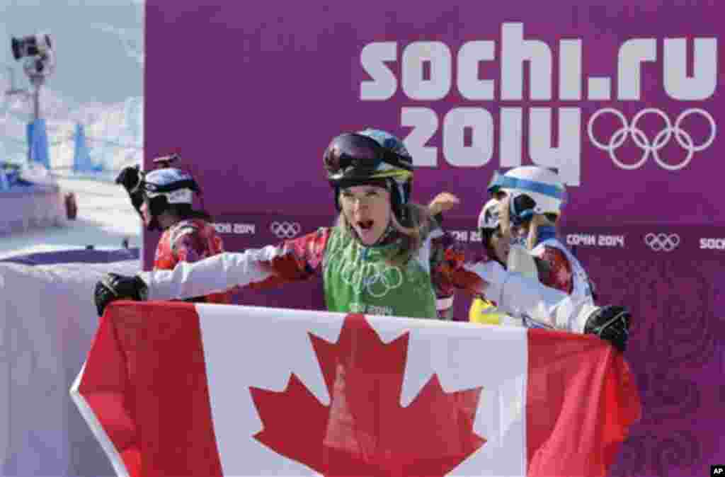 Dominique Maltais of Canada celebrates after taking the silver medal in the women's snowboard cross final at the Rosa Khutor Extreme Park, at the 2014 Winter Olympics, Sunday, Feb. 16, 2014, in Krasnaya Polyana, Russia.  (AP Photo/Andy Wong)