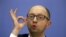 FILE - Ukrainian Prime Minister Arseny Yatseniuk gestures at a news conference in Kyiv, in this file picture taken December 30, 2014. 