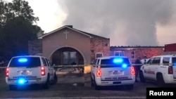 Louisiana State Fire Marshall vehicles are seen outside the Greater Union Baptist Church during a fire, in Opelousas, April 2, 2019, in this picture obtained from social media. 