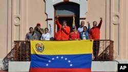 Venezuelan President Nicolas Maduro speaks to supporters from a balcony at Miraflores presidential palace during a rally marking the anniversary of the coup that overthrew dictator Marcos Perez Jimenez in 1958, in Caracas, Jan. 23, 2020. 