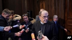 Cardinal Philippe Barbarin speaks during a press conference in Lyon, central France, after a French appeals court acquitted him of covering up the sexual abuse of minors in his flock, Jan.30, 2020.