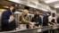 U.S. President Joe Biden and first lady Jill Biden, Vice President Kamala Harris and the second gentleman Doug Emhoff participate in a holiday service project at D.C. Central Kitchen in Washington, Nov. 23, 2021. 