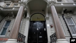 FILE - The main entrance to a building where offices of Orbis Business Intelligence Ltd. are located is seen in central London, Jan. 12, 2017.