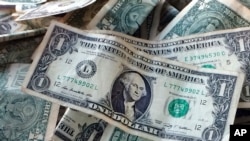This Oct. 24, 2016, photo shows dollar bills in New York. 