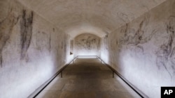 Delicate charcoal drawings that some experts have attributed to Michelangelo are seen on the walls of a room used to store coal until 1955 inside Florence's Medici Chapel, in central Italy, Tuesday, Oct. 31, 2023. (Francesco Fanfani via AP, HO)