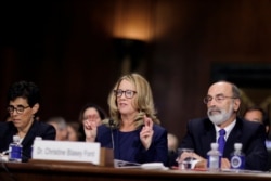 FILE - Professor Christine Blasey Ford, who has accused Brett Kavanaugh of a sexual assault in 1982, testifies before a Senate Judiciary Committee confirmation hearing for Kavanaugh on Capitol Hill in Washington.