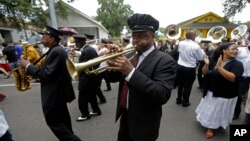 FILE - Musicians are seen participating in a traditional jazz funeral in New Orleans, Louisiana.