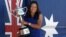 China's Li Na poses for photos at Brighton Beach with her Australian Open trophy following her win over Slovakia's Dominika Cibulkova in Melbourne, Australia, Jan. 26, 2014.