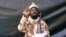 FILE - A grab made on July 13, 2013 from a video obtained by AFP shows the leader of the Islamist extremist group Boko Haram Abubakar Shekau, dressed in camouflage and holding an Kalashnikov AK-47. 