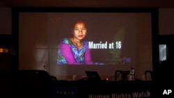 A portrait of a girl who was married at age 16 is shown in a presentation by New York-based Human Rights Watch during the release of a report on child marriage in Nepal in Kathmandu, Nepal, Sept. 8, 2016.