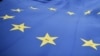 Protestors carry a giant EU flag during an anti-Brexit march on the first day of the Conservative Party annual conference in Manchester on Oct. 1, 2017.