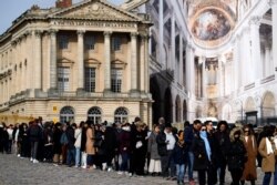 Visitors stand in line to enter the Chateau de Versailles, west of Paris, March 3, 2020.