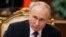 Russian President Vladimir Putin meets with First Deputy Prime Minister Denis Manturov at the Kremlin, in Moscow, Nov. 20, 2024.