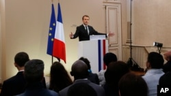 French President Emmanuel Macron gestures as he delivers a speech during a citizenship ceremony in Orleans, central France, July 27, 2017. During his visit to Orleans, Macron suggested to set up "hotspots" in Libya to process asylum-seekers to stem the flow of migrants.