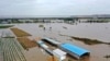 FILE - In this photo released by Xinhua News Agency, an aerial photo shows an overflowing Yellow River near the Lianbo Village in Hejin City, northern China's Shanxi Province, Oct. 10, 2021.