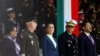 FILE - Mexico's Defense Minister Ricardo Trevilla Trejo and Secretary of the Navy Raymundo Pedro Morales Angeles stand next to Mexico's President Claudia Sheinbaum during a ceremony in Mexico City, Mexico, October 3, 2024. 