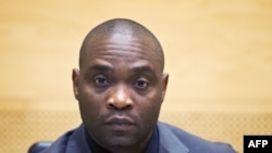 Germain Katanga, ex-chef de milice de République démocratique du Congo, assiste à son procès devant la Cour pénale internationale (CPI) à La Haye, 23 mai 2014.