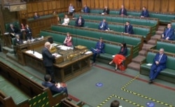 Britain's Prime Minister Boris Johnson speaks in the House of Commons in London, Sept. 14, 2020, in a video grab from footage broadcast by the UK Parliament's Parliamentary Recording Unit.