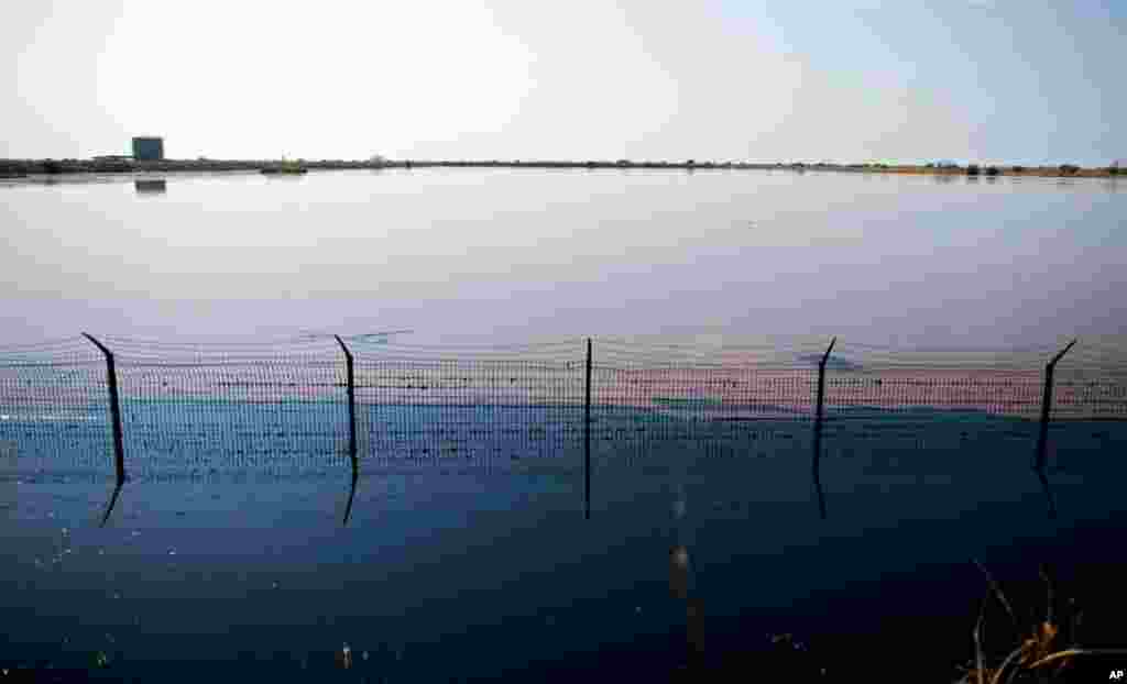 Waste-water pools outside the Petrodar oil facility in Paloich, southern Sudan. Six government officials from the south's oil producing region flew to China earlier in fall 2010, and analysts say China is trying to improve ties with the south and maintai