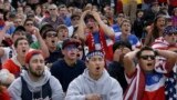Alex Dubin, 17, center top, reacts with other U.S. fans while watching the 2014 World Cup soccer match between the United States and Germany at a public viewing party in San Francisco.
