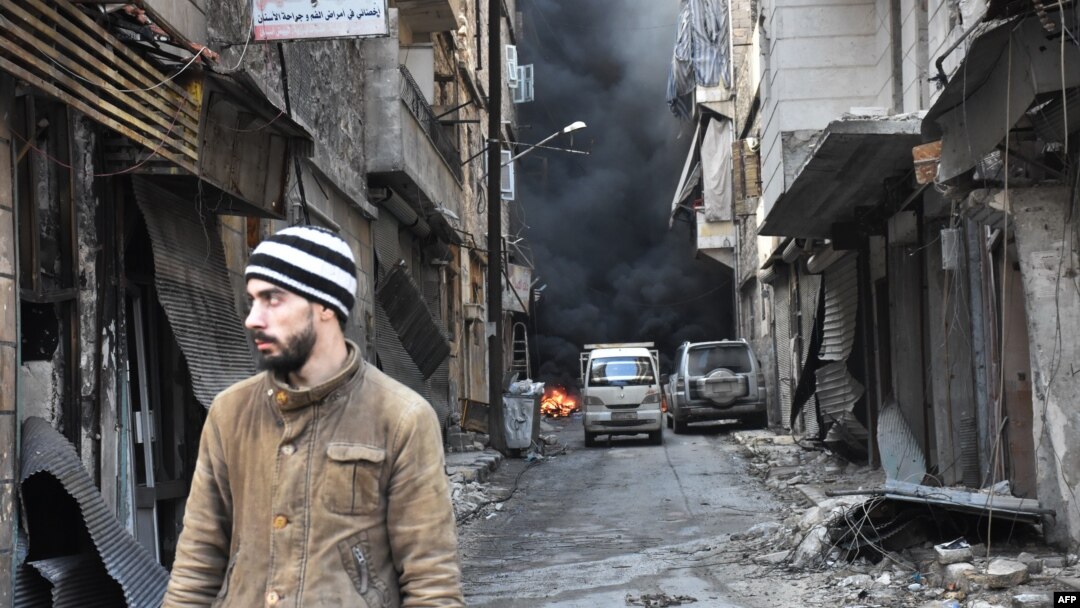 FRILE - A Syrian man walks through the former rebel-held Salaheddin district in the northern Syrian city of Aleppo.