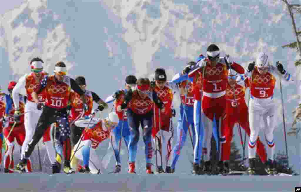 Sweden's Lars Nelson, fourth from left, gets back into the race after falling during the men's 4x10K cross-country relay at the 2014 Winter Olympics, Sunday, Feb. 16, 2014, in Krasnaya Polyana, Russia. (AP Photo/Dmitry Lovetsky)