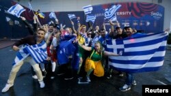 Fans wave flags before the Eurovision Song Contest 2017 Grand Final at the International Exhibition Center in Kyiv, Ukraine, May 13, 2017. 