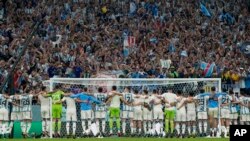 Team Argentina celebrate with supporters after the World Cup semifinal soccer match between Argentina and Croatia at the Lusail Stadium in Lusail, Qatar, Tuesday, Dec. 13, 2022.