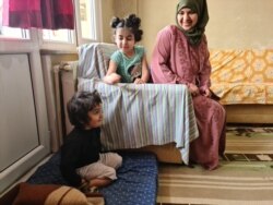 Marwa al-Awas, Mohammed's wife, fears travel to Europe but sees no other way to educate her children, April 17, 2021. (Heather Murdock/VOA)