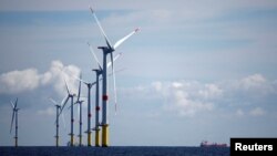FILE - Wind turbines are seen at the Saint-Nazaire offshore wind farm, off the coast of the Guerande peninsula in western France, Sept. 30, 2022.