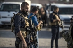 Members of the Kurdish-led Syrian Democratic Forces (SDF) are pictured near the northern Syrian town of Hasakeh, Oct. 10, 2019.