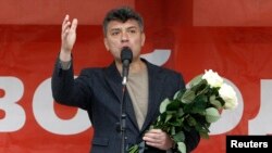 FILE - Boris Nemtsov addresses supporters during a protest rally in Moscow, May 6, 2013.