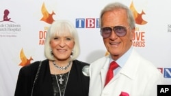 FILE - Shirley and Pat Boone arrive at Lipscomb University for the Dove Awards, Oct. 7, 2014, in Nashville, Tenn.