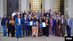 Members of the Kurdish community pose with Nashville's Metropolitan Council staff to honor 50 years of Kurdish presence in the city. 