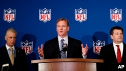 NFL commissioner Roger Goodell (C) is flanked by Pittsburgh Steelers president Art Rooney II (L), and Arizona Cardinals owner Michael Bidwill during a news conference where he announced that NFL team owners have reached agreement on a new league policy that requires players to stand for the national anthem or remain in the locker room, during the NFL owner's spring meeting May 23, 2018, in Atlanta. 