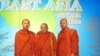 Newly re-ordained monk Tim Sakhorn, middle, drops by VOA Khmer while on a visit in the US last week. 