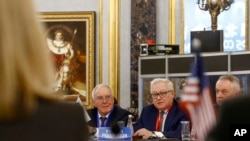 Russian Deputy Foreign Minister Sergey Ryabkov, center, head of a delegation, looks at a U.S. delegation, foreground, as he delivers his opening remarks during a Treaty on NPT conference in Beijing, Jan. 30, 2019. 