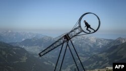 Swiss acrobat Ramon Kathriner performs with the &quot;Wheel of The Death&quot; during the Glacier 3000 Air show an event marking the reopening of the Alpine facilities above Les Diablerets following the lockdown due to the COVID-19 outbreak.